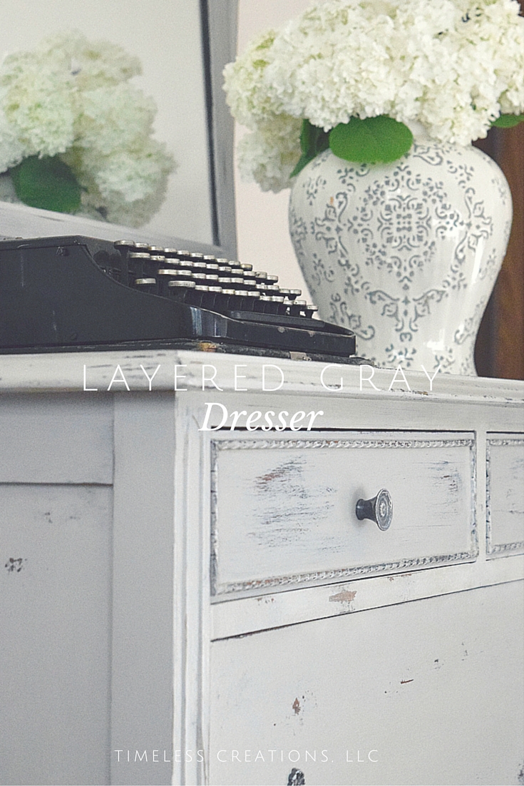 Layering paint to get a multi-colored distressed look on a dresser-Timeless Creations, LLC